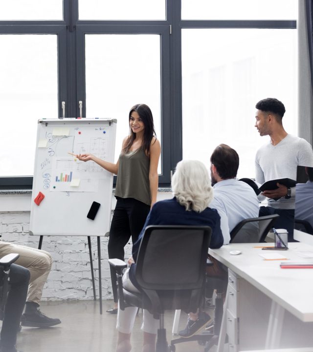 business-woman-making-presentation-office-scaled.jpg